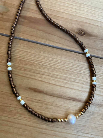 Brown choker with one pearl