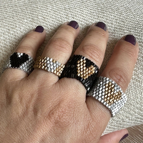 The PUT A RING ON IT collection: Heart Series, golden on black, 8 rows!