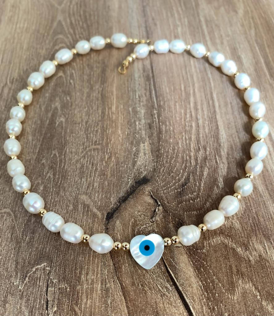 Freshwater pearls and mother of pearl heart eye