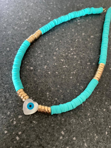 Turquoise surf choker with mother of pearl heart eye